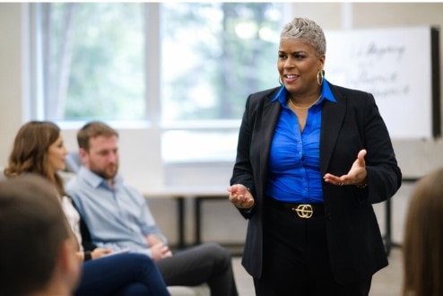 Dr. Rachel Alex speaking at a professional development workshop