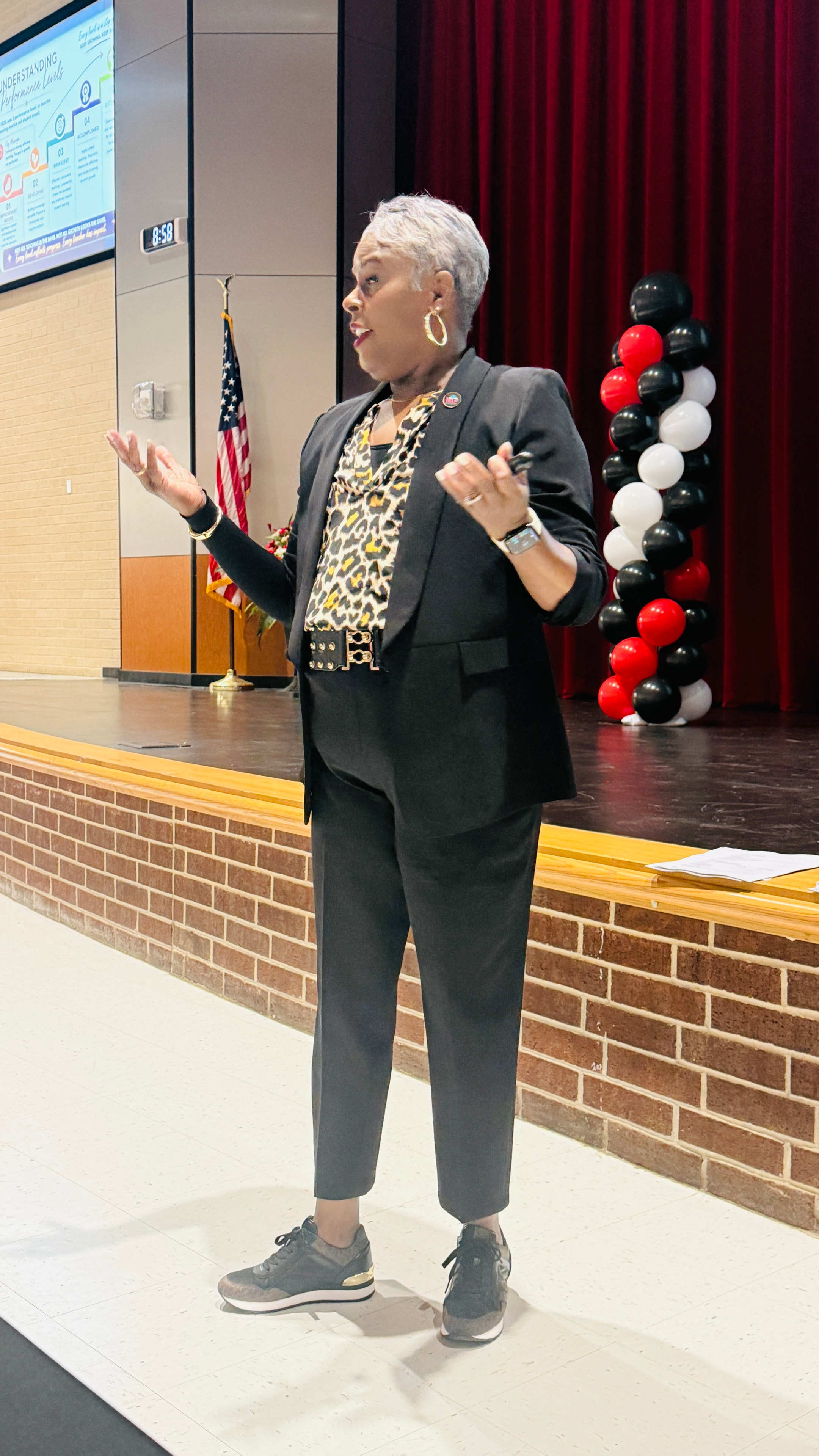 Dr. Rachel Alex presenting at a school event